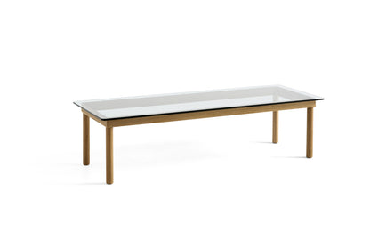 Table basse Kofi 140 x 50 cm, verre clair et piètement en chêne laqué naturel