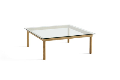 Table basse Kofi 100 x 100 cm, verre clair et piètement en chêne laqué naturel